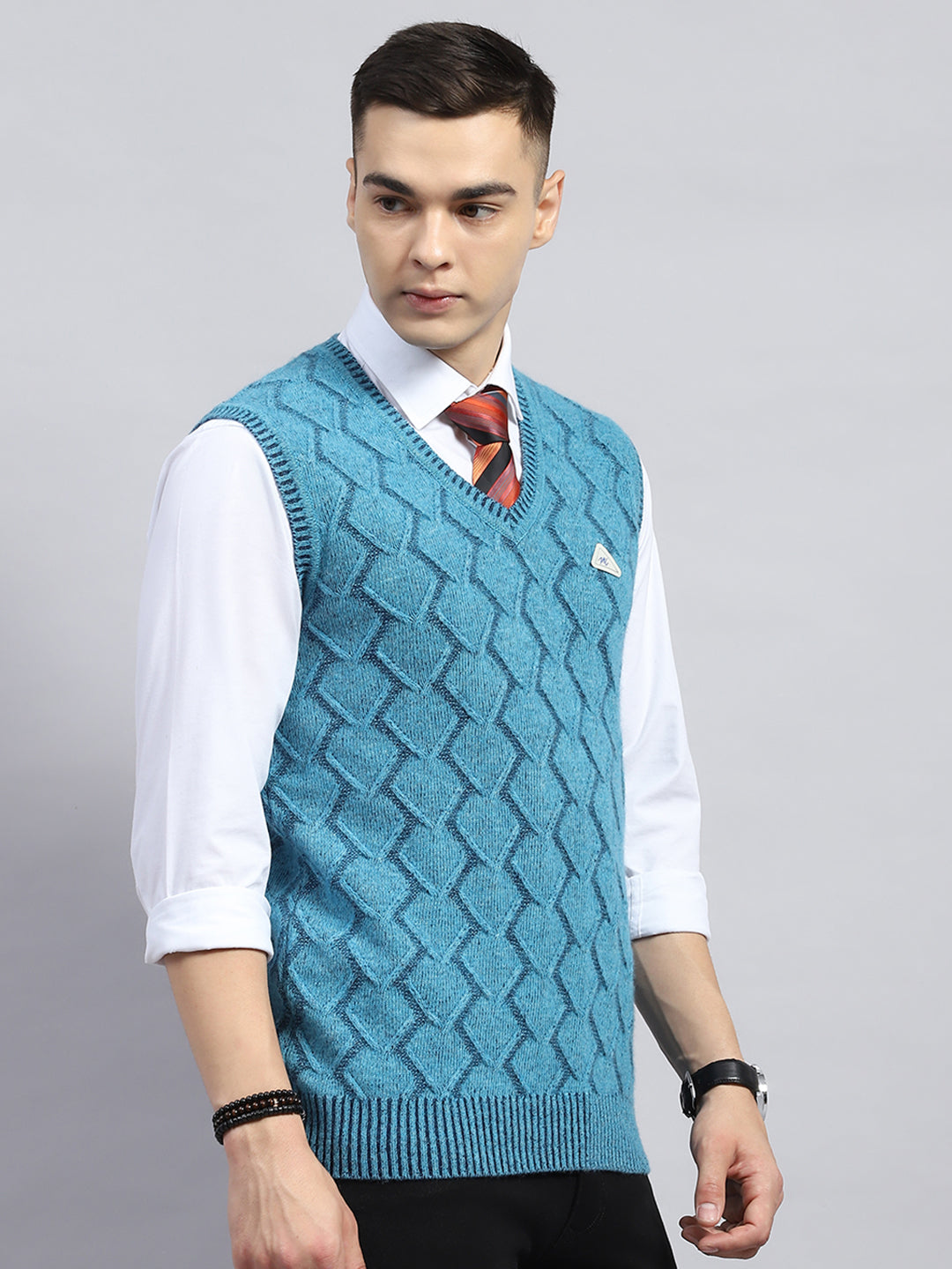 Men Blue Self Design V Neck Sleeveless Sweater