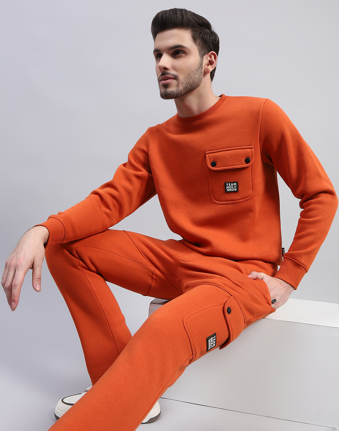 Men Orange Solid Round Neck Full Sleeve Tracksuit