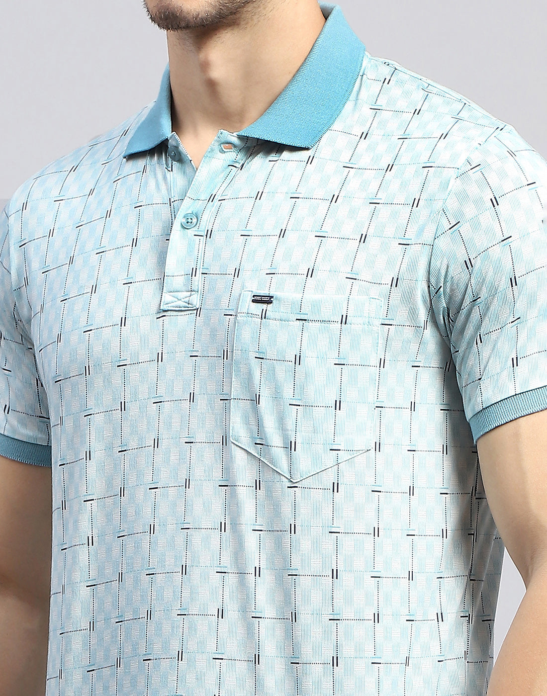 Men Sky Blue Self Design Polo Collar Half Sleeve T-Shirt