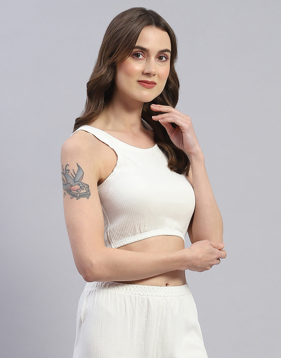 Women Off White Solid Round Neck Sleeveless Thermal Blouse